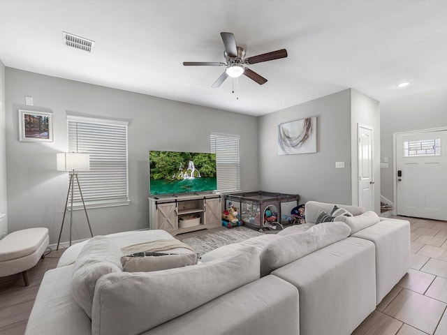 7718 Duncan St, Houston, TX 77093 - living area with ceiling fan and baseboards