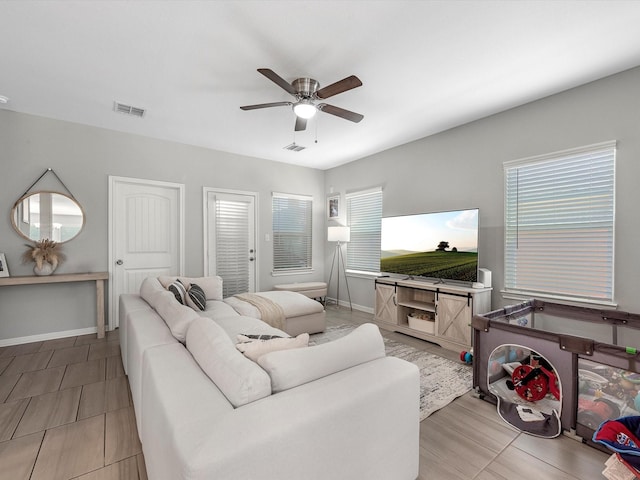7718 Duncan St, Houston, TX 77093 - living area featuring ceiling fan and baseboards