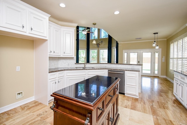 3911 Fielder Cir, Missouri City, TX 77459 - kitchen with a sink, dishwasher, a peninsula, a ceiling fan, and white cabinets