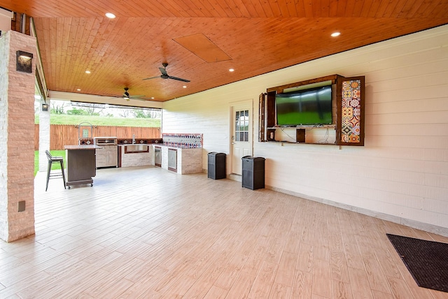 3911 Fielder Cir, Missouri City, TX 77459 - view of patio / terrace with exterior kitchen, a ceiling fan, and a sink