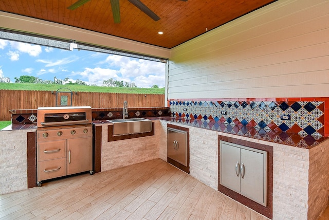 3911 Fielder Cir, Missouri City, TX 77459 - view of patio / terrace with a sink, ceiling fan, an outdoor kitchen, and a deck