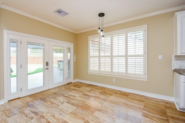 3911 Fielder Cir, Missouri City, TX 77459 - unfurnished dining area with ornamental molding, french doors, and baseboards