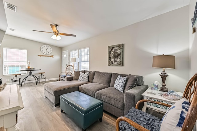 4126 Reeves Dr, Galveston, TX 77554 - living room with ceiling fan, wood finished floors, and baseboards