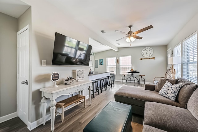 4126 Reeves Dr, Galveston, TX 77554 - living room with ceiling fan, healthy amount of natural light, baseboards, and beamed ceiling