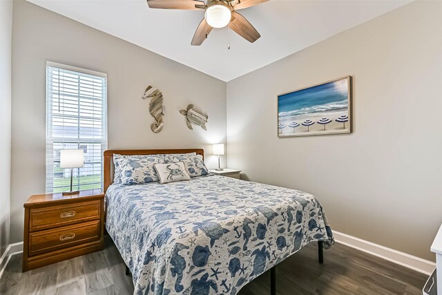 4126 Reeves Dr, Galveston, TX 77554 - bedroom featuring baseboards, wood finished floors, and ceiling fan