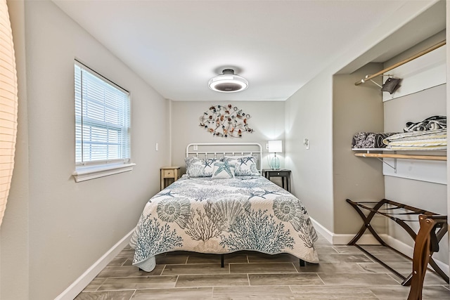 4126 Reeves Dr, Galveston, TX 77554 - bedroom with baseboards and wood finish floors
