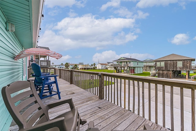4126 Reeves Dr, Galveston, TX 77554 - wooden terrace with a residential view