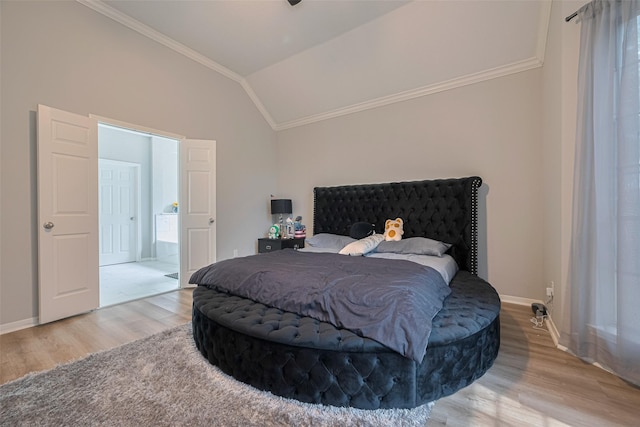 6718 Cleft Stone Dr, Houston, TX 77084 - bedroom featuring wood finished floors, crown molding, baseboards, and lofted ceiling