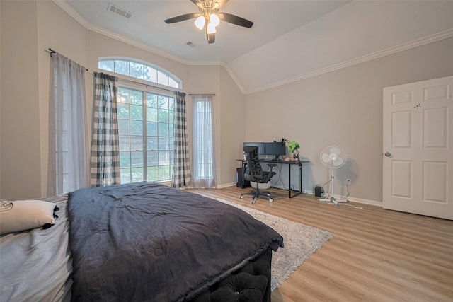 6718 Cleft Stone Dr, Houston, TX 77084 - bedroom featuring light wood-style floors, crown molding, baseboards, lofted ceiling, and a ceiling fan