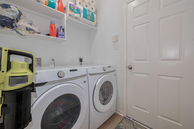 6718 Cleft Stone Dr, Houston, TX 77084 - laundry area with washer and clothes dryer and light wood-style floors