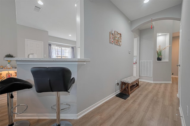 6718 Cleft Stone Dr, Houston, TX 77084 - foyer entrance featuring arched walkways, light wood finished floors, baseboards, and recessed lighting