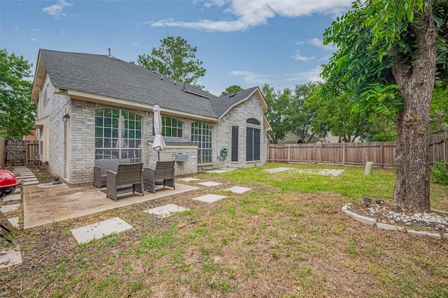6718 Cleft Stone Dr, Houston, TX 77084 - back of house with brick siding, a patio area, and a shingled roof