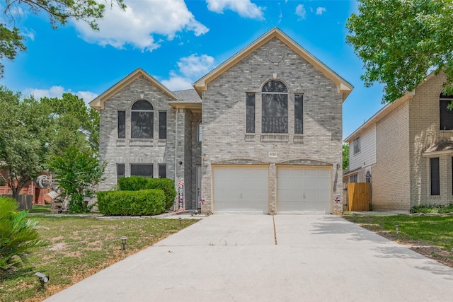 6718 Cleft Stone Dr, Houston, TX 77084 - traditional-style home with driveway, a garage, and brick siding