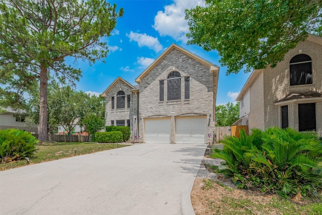 6718 Cleft Stone Dr, Houston, TX 77084 - view of front of property featuring a garage, concrete driveway, and brick siding