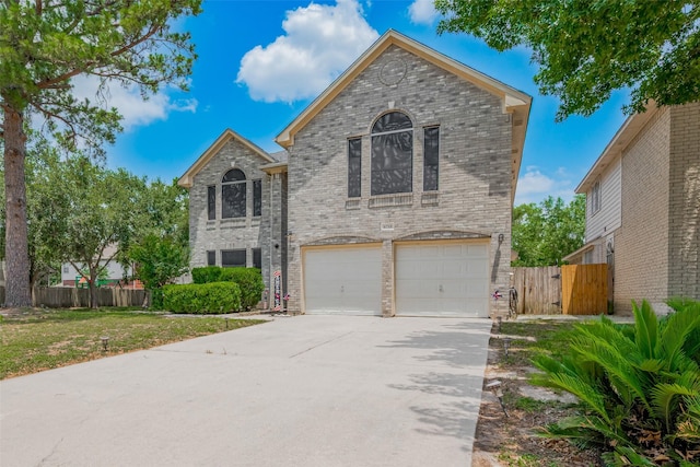 6718 Cleft Stone Dr, Houston, TX 77084 - view of front facade featuring brick siding, a garage, and concrete driveway