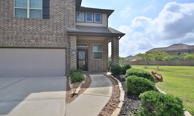 29885 Dovetail Bluff Ln, Spring, TX 77386 - property entrance featuring brick siding, an attached garage, and concrete driveway