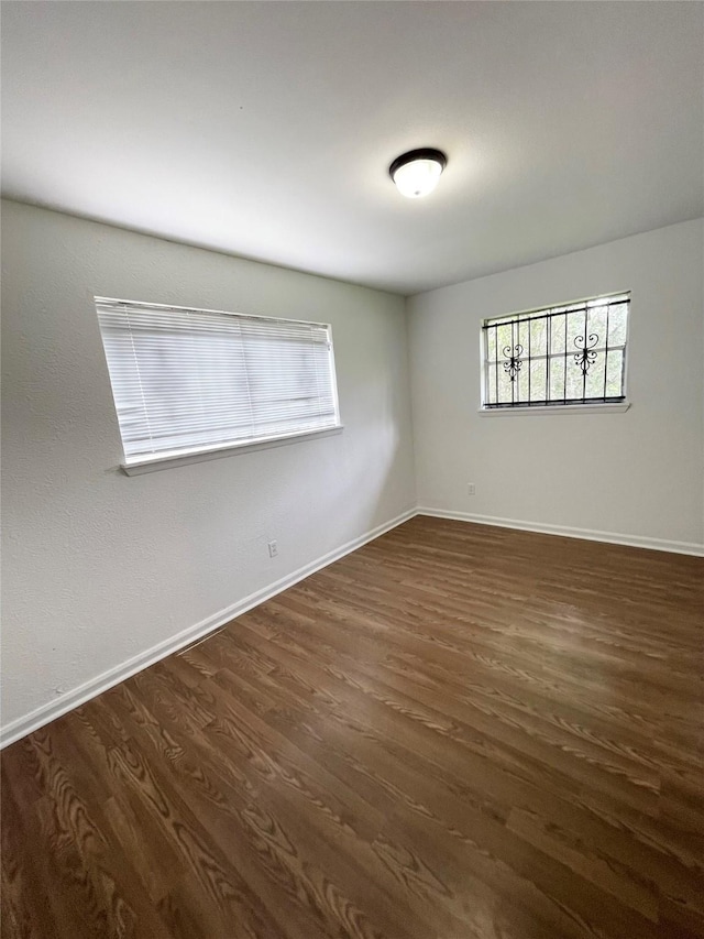 4118 Ebbtide Dr, Houston, TX 77045 - spare room with dark wood-style flooring and baseboards