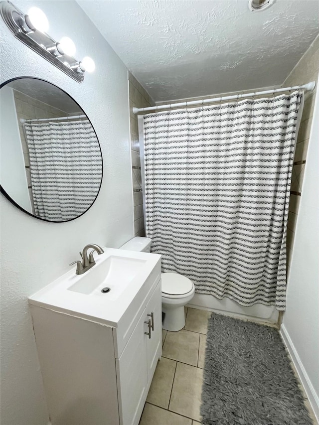 4118 Ebbtide Dr, Houston, TX 77045 - full bathroom with toilet, vanity, tile patterned flooring, shower / bath combination with curtain, and a textured ceiling