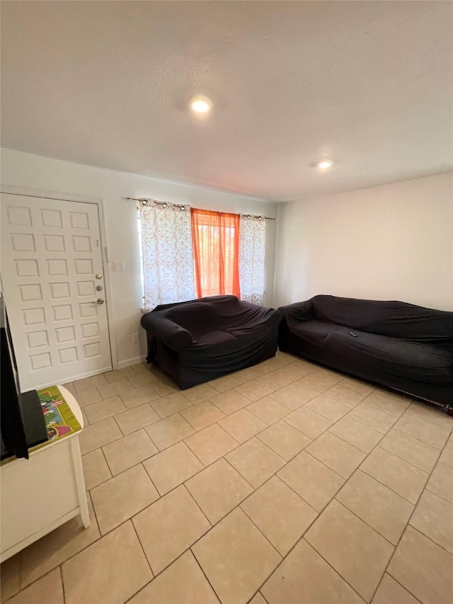 4118 Ebbtide Dr, Houston, TX 77045 - living area featuring light tile patterned floors and recessed lighting