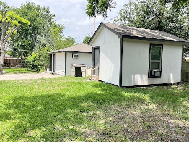 4118 Ebbtide Dr, Houston, TX 77045 - back of house featuring an outbuilding and roof with shingles