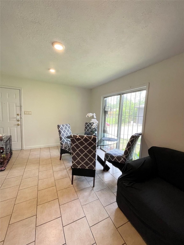 4118 Ebbtide Dr, Houston, TX 77045 - living area with a textured ceiling, light tile patterned flooring, and recessed lighting