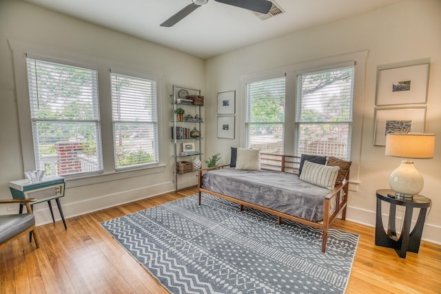 1708 S Park St, Brenham, TX 77833 - bedroom featuring multiple windows, wood finished floors, and baseboards