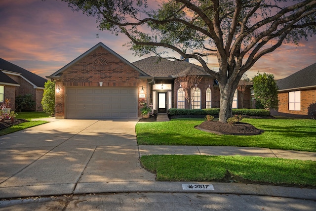 2517 Royal Terns Ct, League City, TX 77573 - view of front of property featuring brick siding, driveway, a yard, and an attached garage