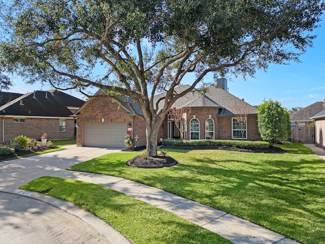 2517 Royal Terns Ct, League City, TX 77573 - traditional-style home featuring brick siding, an attached garage, driveway, and a chimney
