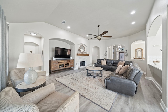 2517 Royal Terns Ct, League City, TX 77573 - living area with a ceiling fan, vaulted ceiling, wood finished floors, arched walkways, and recessed lighting