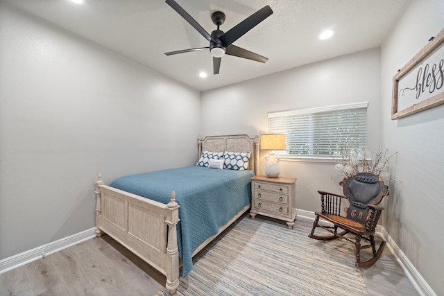 2517 Royal Terns Ct, League City, TX 77573 - bedroom with wood finished floors, recessed lighting, baseboards, and ceiling fan