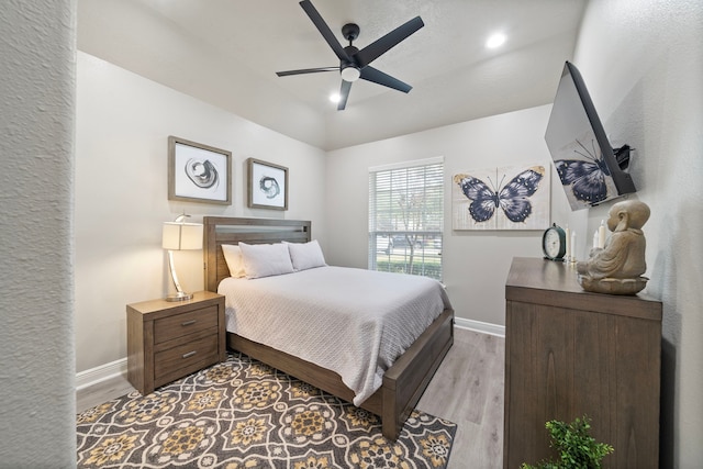 2517 Royal Terns Ct, League City, TX 77573 - bedroom featuring baseboards, wood finished floors, recessed lighting, a ceiling fan, and lofted ceiling