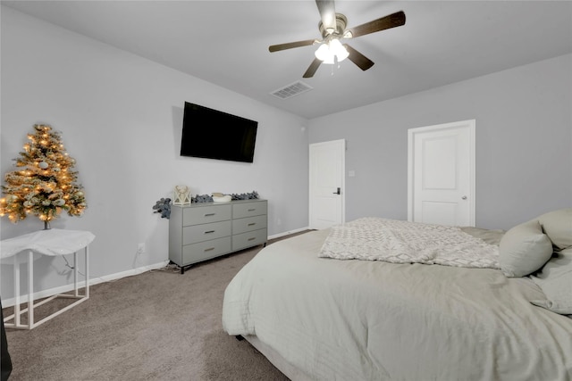 8835 Willet St, Baytown, TX 77521 - carpeted bedroom with baseboards and a ceiling fan