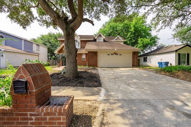 15034 Elstree Dr, Channelview, TX 77530 - view of front of home featuring brick siding, concrete driveway, a shingled roof, and a garage