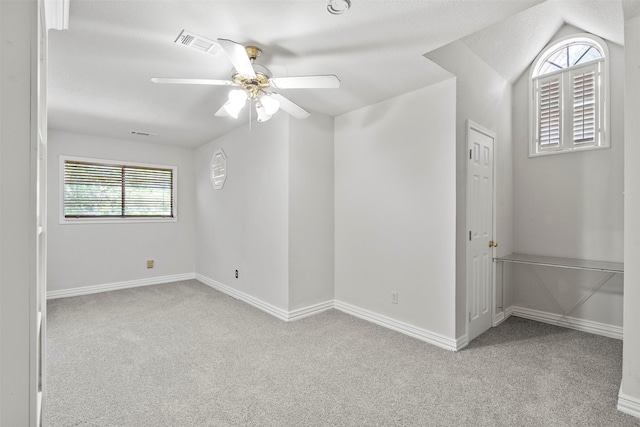 15034 Elstree Dr, Channelview, TX 77530 - empty room with carpet, a ceiling fan, baseboards, and vaulted ceiling