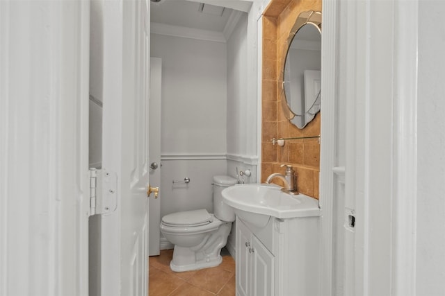 15034 Elstree Dr, Channelview, TX 77530 - half bathroom featuring crown molding, tile patterned flooring, vanity, and toilet