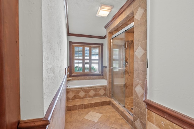 15034 Elstree Dr, Channelview, TX 77530 - full bath with a bath, a stall shower, ornamental molding, tile patterned floors, and a textured wall
