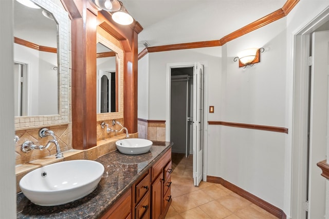 15034 Elstree Dr, Channelview, TX 77530 - full bath featuring double vanity, ornamental molding, tile patterned floors, decorative backsplash, and baseboards