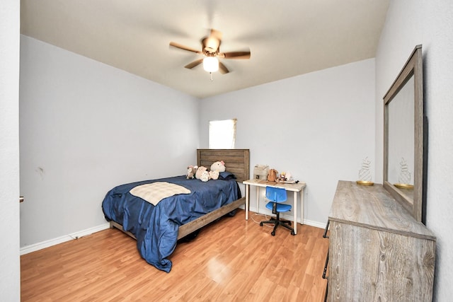 7831 Wileyvale Rd, Houston, TX 77016 - bedroom with light wood finished floors, baseboards, and ceiling fan