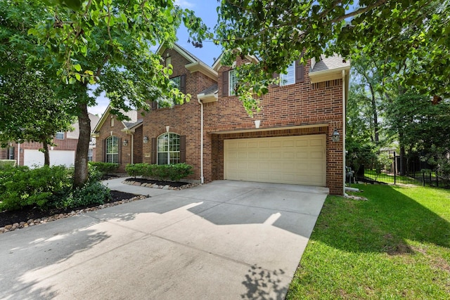 95 W Hullwood Cir, The Woodlands, TX 77389 - traditional-style home with driveway, brick siding, and a garage