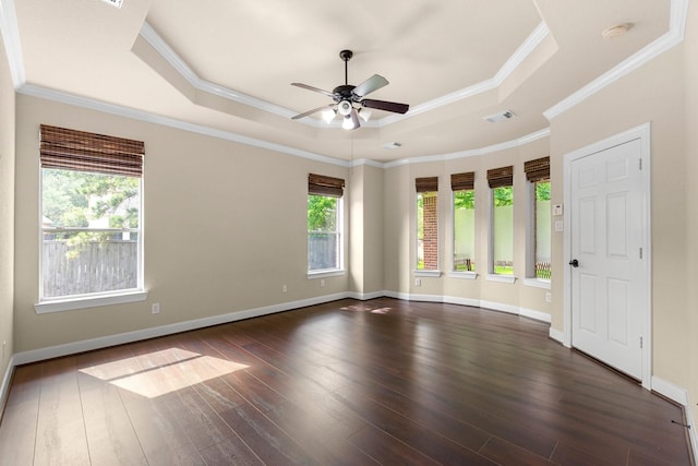 95 W Hullwood Cir, The Woodlands, TX 77389 - empty room with a raised ceiling, ceiling fan, dark wood-style flooring, a smoke detector, and baseboards