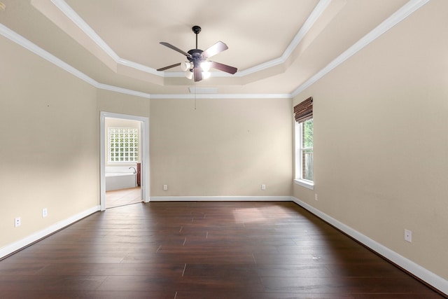 95 W Hullwood Cir, The Woodlands, TX 77389 - empty room with a tray ceiling, ceiling fan, dark wood-type flooring, ornamental molding, and baseboards
