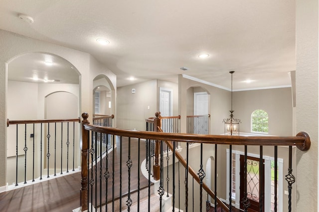 95 W Hullwood Cir, The Woodlands, TX 77389 - hall featuring an upstairs landing, recessed lighting, wood finished floors, and ornamental molding