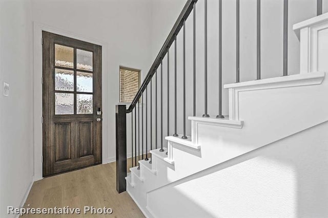 27007 Golden Isle Ln, Katy, TX 77493 - entrance foyer featuring wood finished floors, stairway, and baseboards