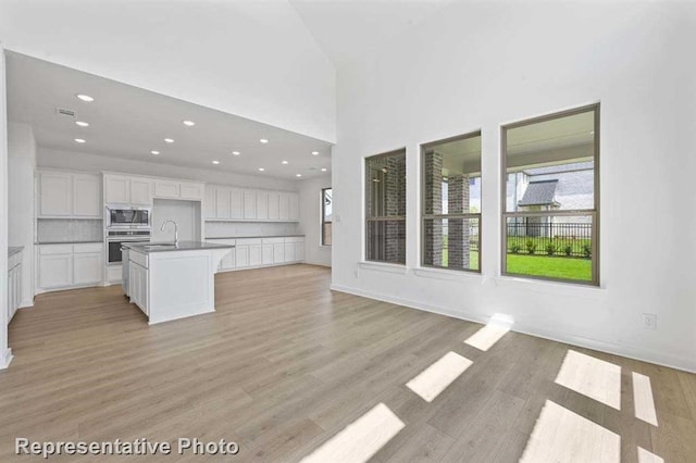 27007 Golden Isle Ln, Katy, TX 77493 - kitchen featuring healthy amount of natural light, stainless steel appliances, open floor plan, and recessed lighting