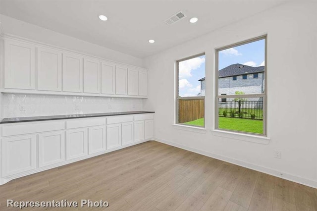 27007 Golden Isle Ln, Katy, TX 77493 - unfurnished room featuring light wood-style flooring, baseboards, and recessed lighting