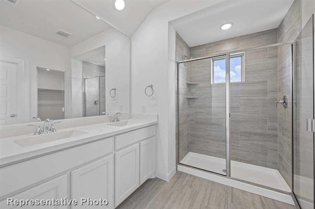 27007 Golden Isle Ln, Katy, TX 77493 - full bathroom featuring a stall shower, double vanity, and recessed lighting