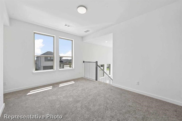 27007 Golden Isle Ln, Katy, TX 77493 - carpeted spare room with healthy amount of natural light and baseboards