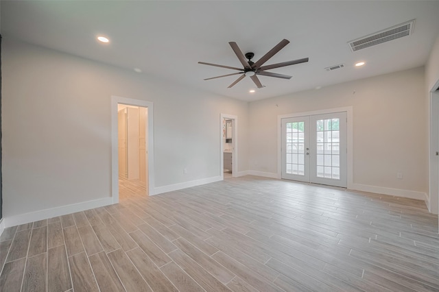 8302 Magna St, Houston, TX 77093 - spare room featuring a ceiling fan, french doors, light wood-style flooring, baseboards, and recessed lighting