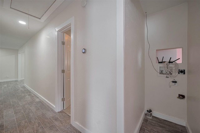 8302 Magna St, Houston, TX 77093 - corridor with attic access, wood finished floors, and baseboards