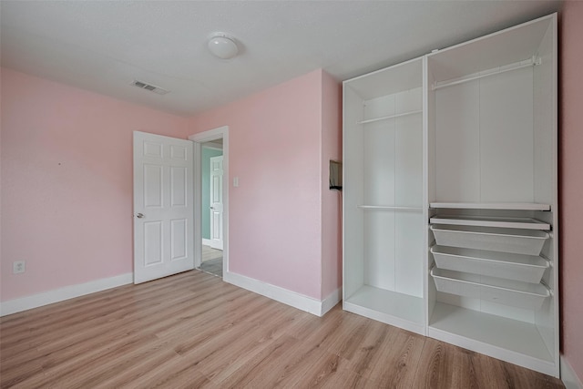 8302 Magna St, Houston, TX 77093 - unfurnished bedroom with wood finished floors and baseboards